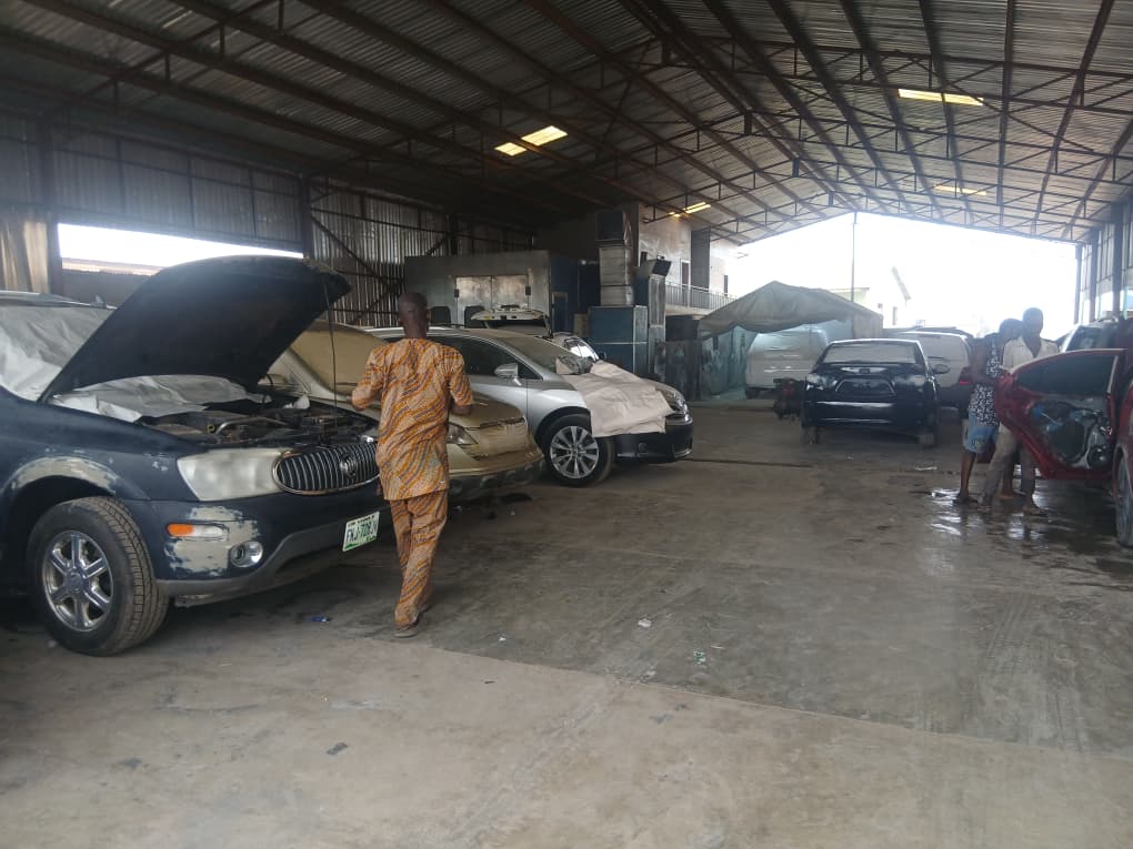 CareTech workshop with mechanic working on BMW