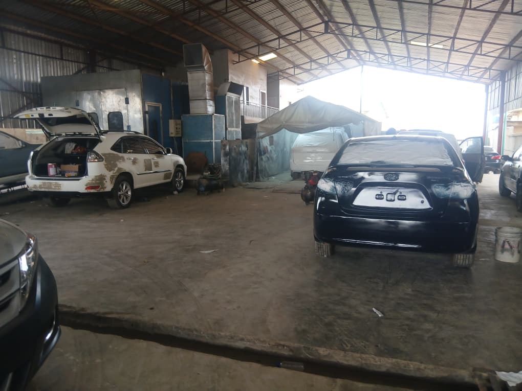 Professional auto repair service with multiple vehicles