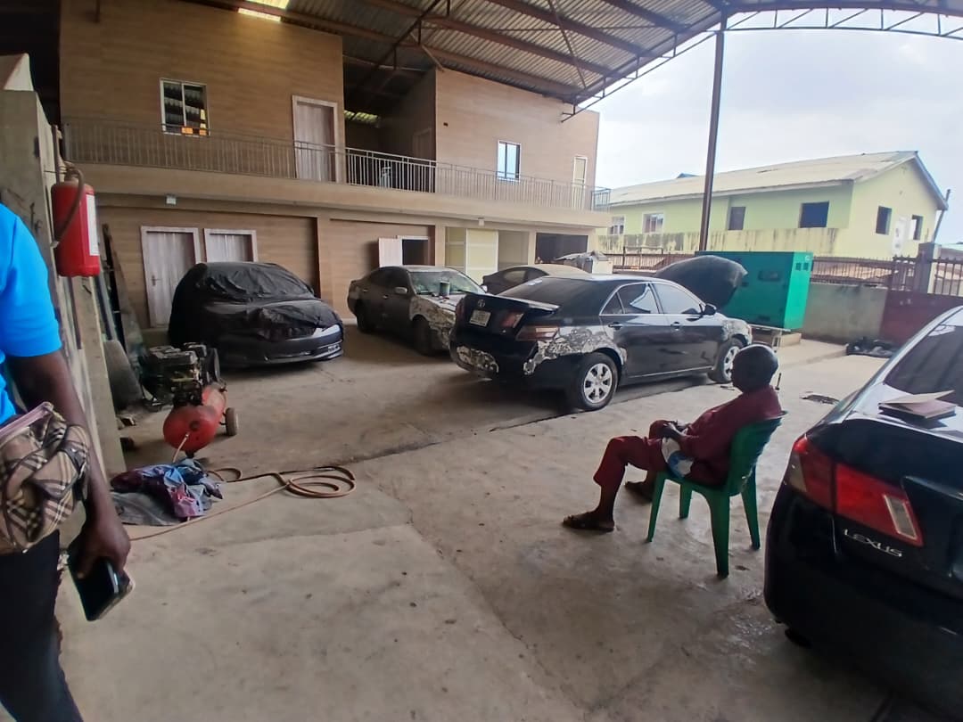 Workshop facility with cars under maintenance