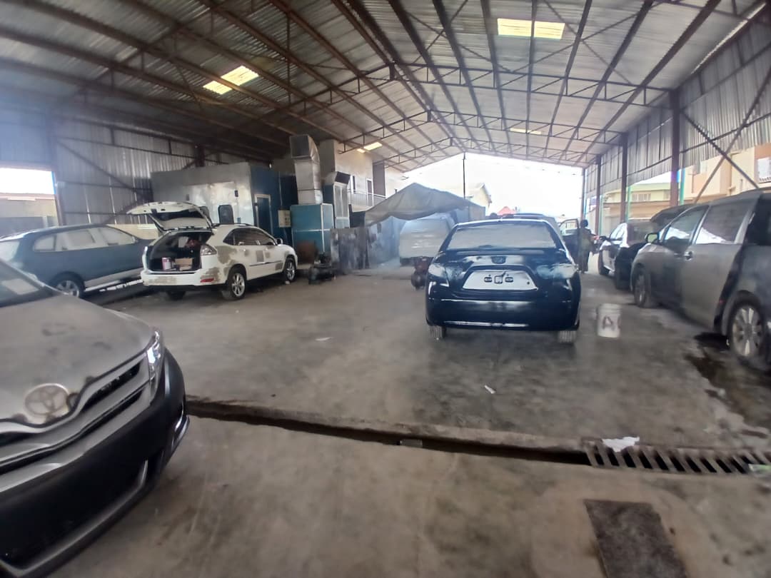 Indoor workshop with vehicles being serviced